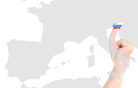 Finger touch on Slovenia map flagの写真素材