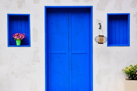 Modern house with colorful blue door and windowの写真素材