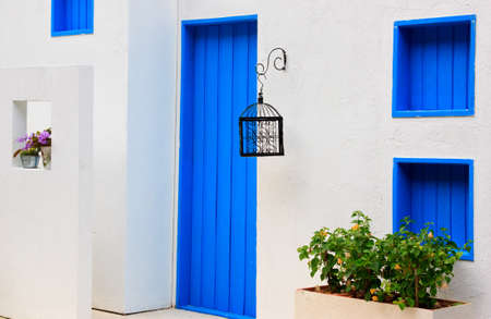 Modern house with colorful blue door and window