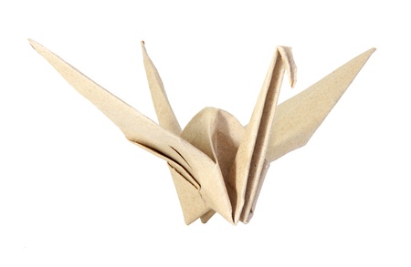 Origami bird made from brown recycle paper isolated on white backgroundの写真素材