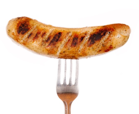 Unhealthy grilled barbecue sausage isolated on white backgroundの写真素材