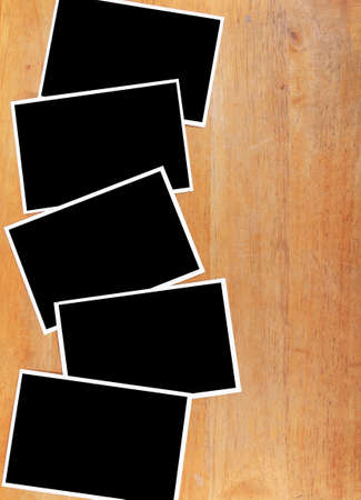 Blank photograph paper on wooden desk