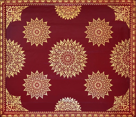 Golden on red thai painting wallpaper, Buddha temple wall and ceiling decorationの写真素材