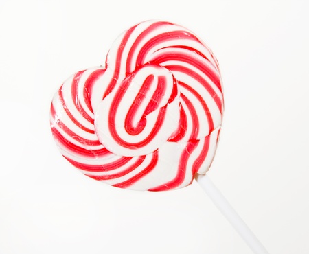 retro style red , pink heart shape lollipop on white backgroundの写真素材