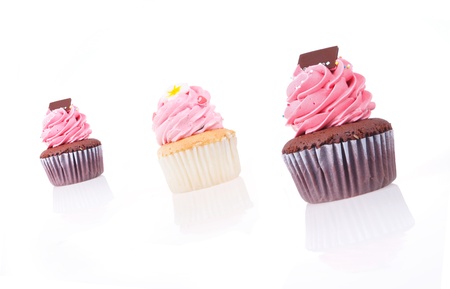 Strawberry cream chocolate cupcake isolated on white backgroundの写真素材