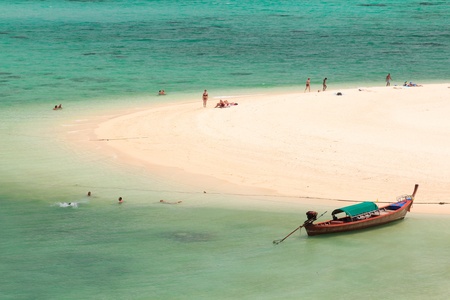 Longtail boat on beach coast of Andaman turquoise sea,Thailandの写真素材