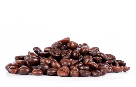 Brown arabica coffee bean isolated on white background の写真素材