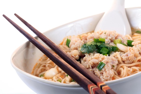 Chinese instant noodle with minced pork bowl isolated on white backgroundの写真素材