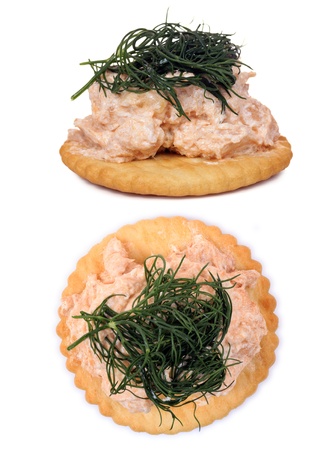 Salmon spread on cracker cookies on white backgroundの写真素材