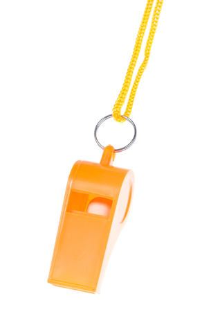 Orange whistle isolated on white backgroundの写真素材