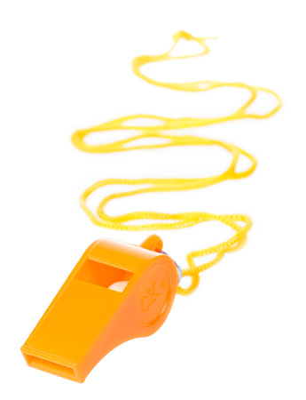Orange whistle isolated on white backgroundの写真素材