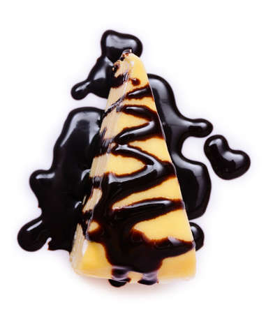 Vanilla crepe cake with hot chocolate fudge on white backgroundの写真素材