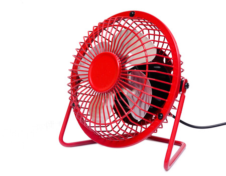 red electric fan on white backgroundの写真素材