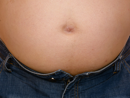 Overweight paunchy fat man on white background