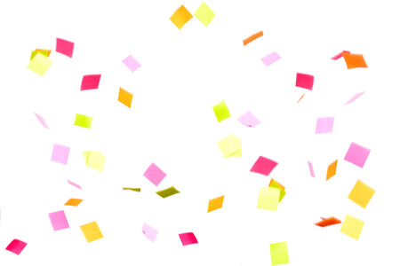 colorful confetti falling on white backgroundの写真素材