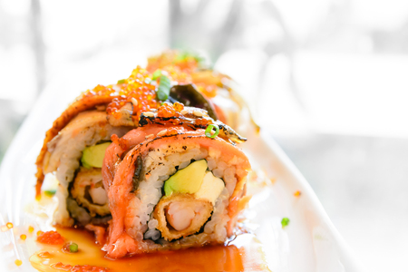 Sushi roll with salmon avocado and eelの写真素材
