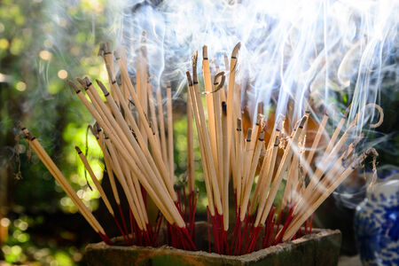 joss sticks with a lot of smokeの写真素材