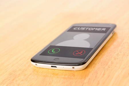 Customer call on smart phoneの写真素材