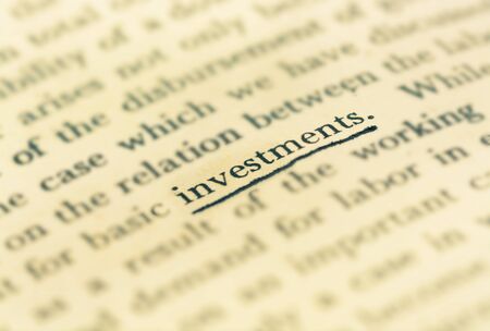 Focus investment word in vintage text bookの写真素材