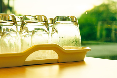 Glass cups beside windowの写真素材