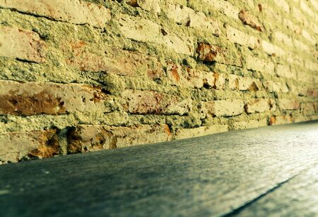 vintage grunge brick wall and wooden table background