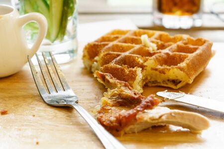 eating waffle and fried chickenの写真素材
