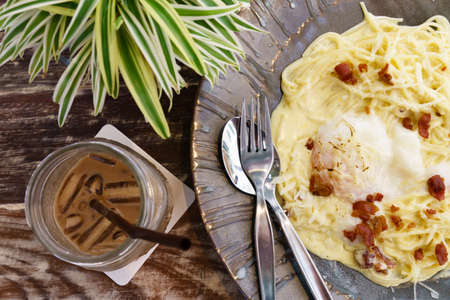 spaghetti Carbonara with bacon and egg yolkの写真素材