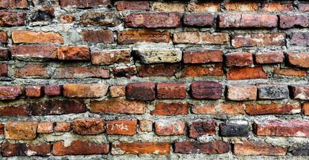Grunge crack orange brick wall background texture