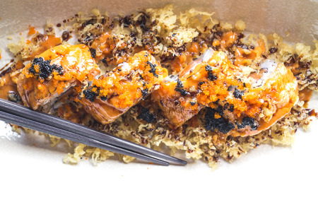 Sushi roll with salmon grill aburi