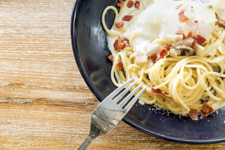 spaghetti carbonara with egg yolkの写真素材