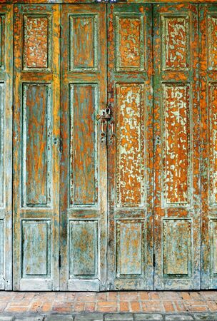 Green vintage grunge wooden door background textureの写真素材