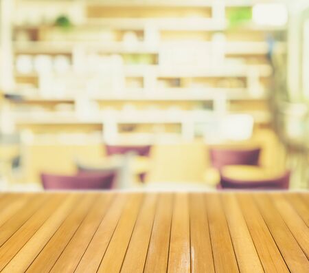 Pine wooden table in blur restaurant background interiorの写真素材