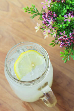 Jar glass lemonade soda on wooden tableの写真素材