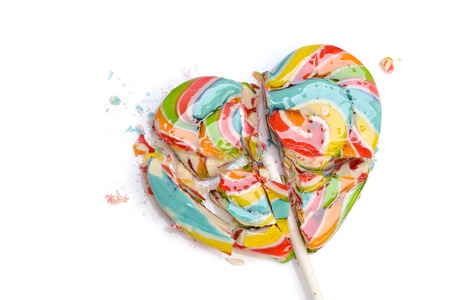 Colorful retro style heart shape lollipop isolated on white backgroundの写真素材