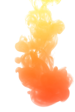 Abstract yellow orange watercolor drop in water background textureの写真素材