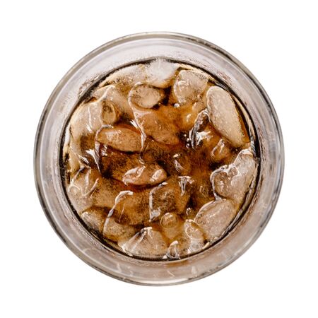 glass of cola soda water and ice cube isolated on white backgroundの写真素材