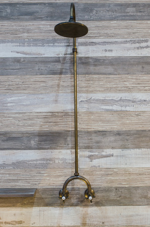 new shower head on the wooden tableの写真素材
