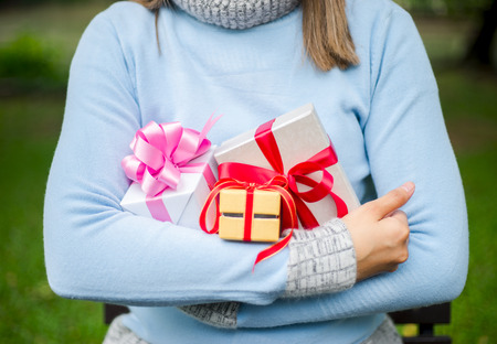 woman woman holding a lot of boxes with giftsの写真素材