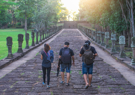 professional photographer with camera and tripod in autumnのeditorial素材