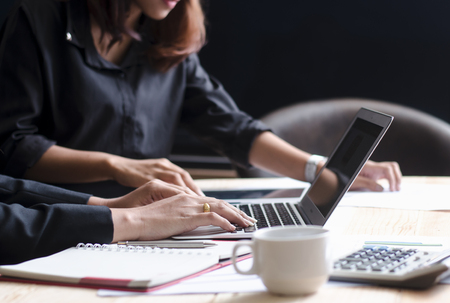 Close up of female accountant or banker making calculations. Savings, finances and economy conceptの写真素材