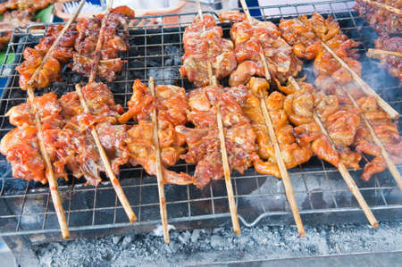 meat grilled over charcoalの写真素材