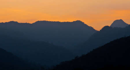 Mountain silhouette in the evening.の写真素材