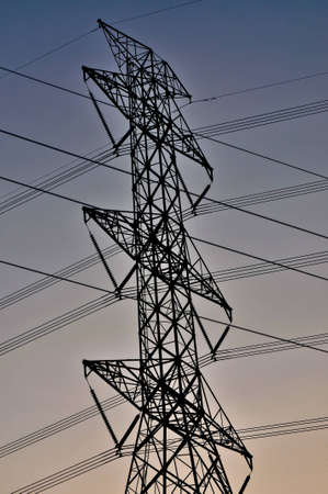 Power line poles on blue sky background .の写真素材