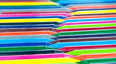 Many colorful wax crayons in a rowの写真素材