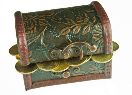 Old style wooden box full with gold money isolated on white background.の写真素材