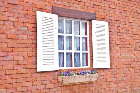 Window white on orange wall.の写真素材