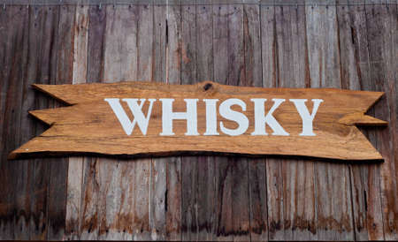 Wooden pub sign of whiskyの写真素材