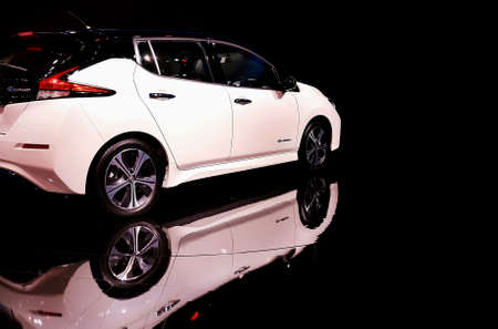 Impact Muang Thong Thani, Thailand - December24,2018 :  Modern sport automotive white car and reflection on the floor with black background in showing display area on Motor expo exhibitionのeditorial素材