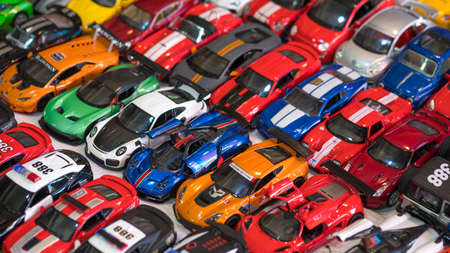 Samut Songkhram, Thailand - August22,2020 : Various of many miniature sport vehicle toys on table...