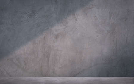 Sunlight and shadow on surface of the old grunge cement wall with concrete floor